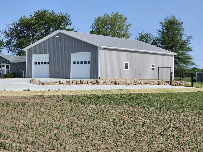 Home with trees and an orange sunset